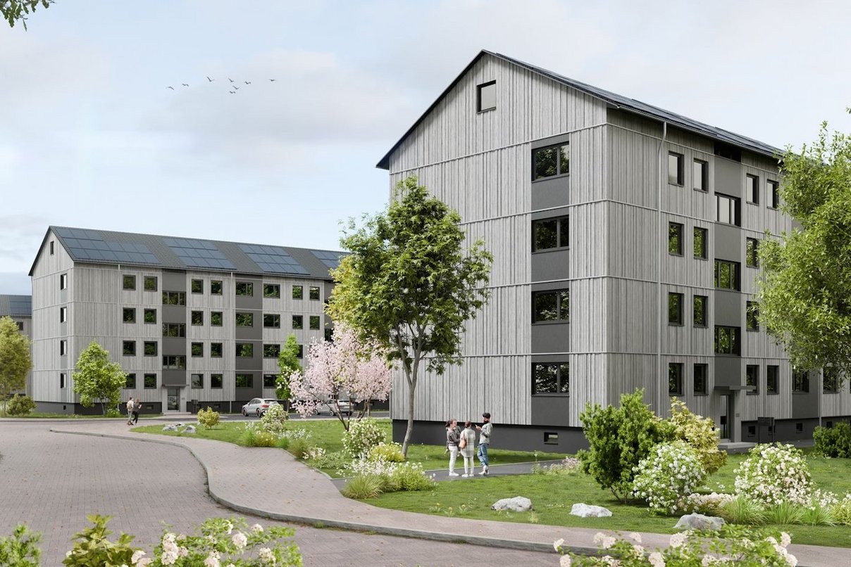 Rendering eines Wohnquartiers mit viergeschossigen Gebäuden und Grünanlagen sowie einer Straße